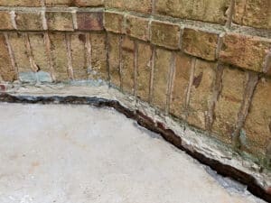 Sinking concrete foundation in need of mudjacking leveling repai